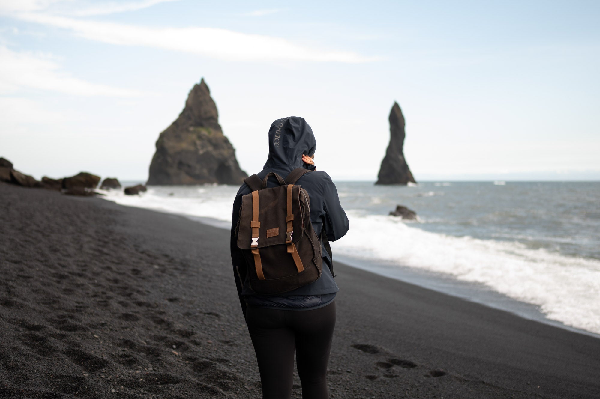 Daniela Sumelius walking on the black beach in Iceland